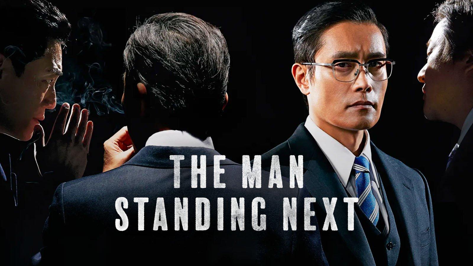 The Man Standing Next